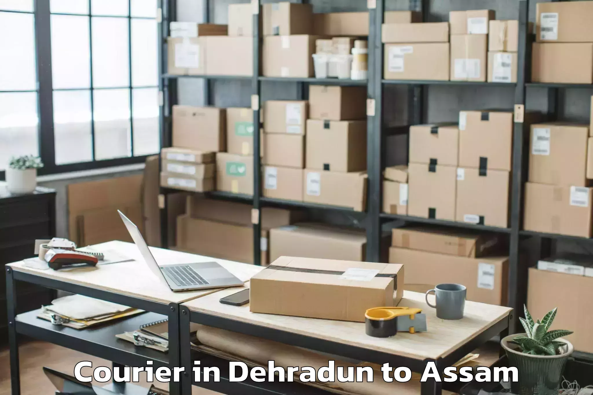 Reliable Dehradun to Raha Courier